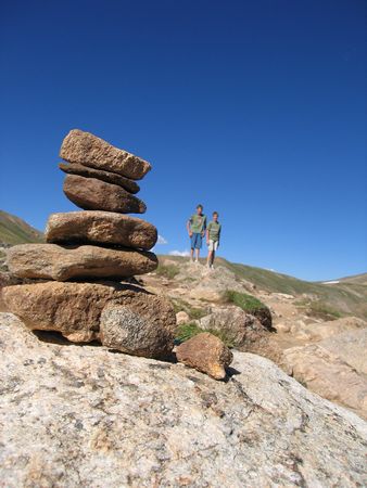 Two cousins beyond a cairn