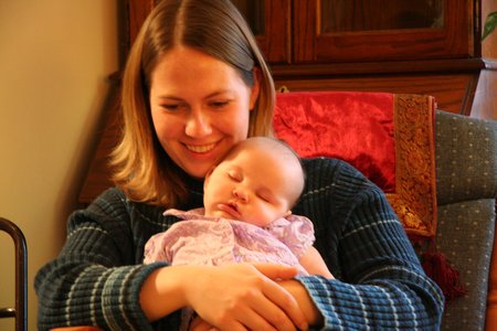 Holding her baby